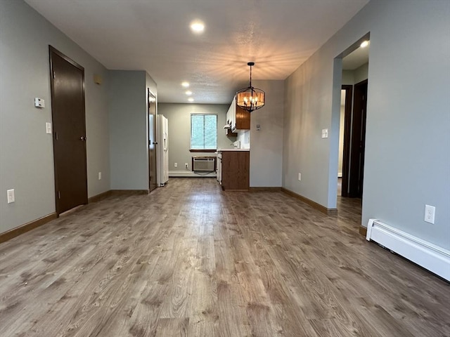 82 S Maple St Unit 44, Westfield, MA 01085 - unfurnished dining area with a chandelier, dark wood finished floors, a wall mounted air conditioner, baseboard heating, and recessed lighting