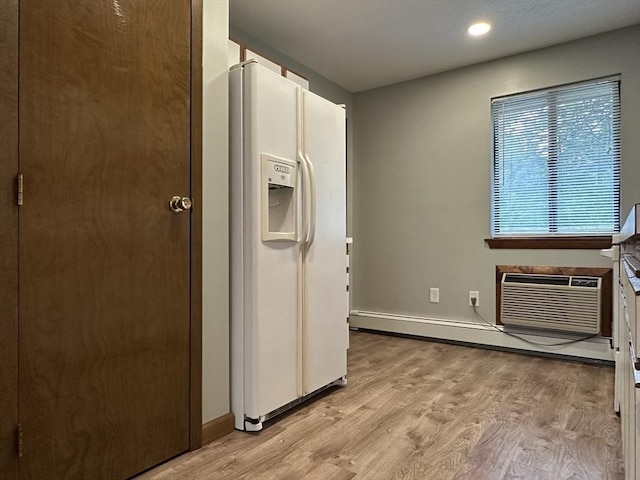82 S Maple St Unit 44, Westfield, MA 01085 - kitchen with white refrigerator with ice dispenser, light wood-style flooring, a wall unit AC, a baseboard radiator, and recessed lighting