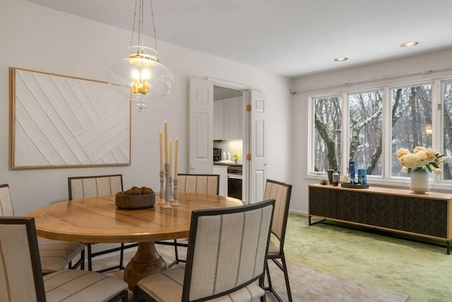 dining space with light colored carpet