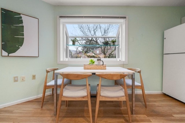 dining area with light wood-type flooring