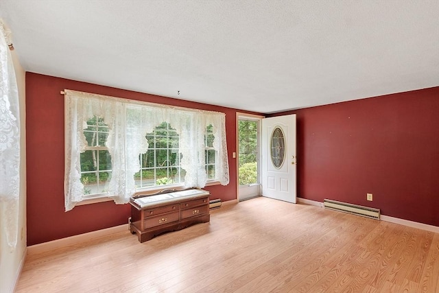 336 Otter River Rd, Templeton, MA 01468 - foyer with a baseboard heating unit and light wood-style floors