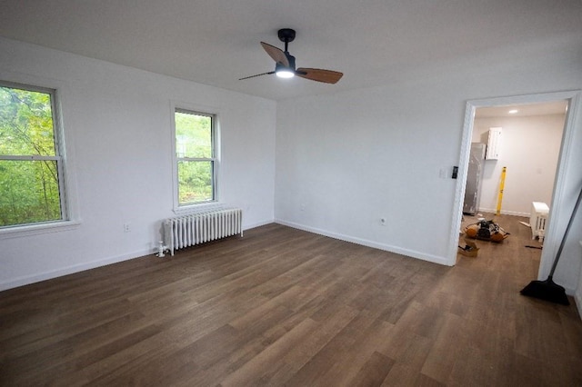 23 Highland St, Townsend, MA 01469 - unfurnished room featuring radiator, wood finished floors, a ceiling fan, and baseboards