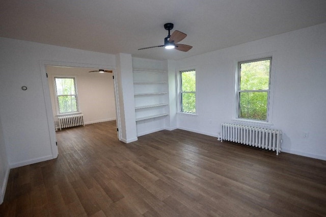 23 Highland St, Townsend, MA 01469 - unfurnished room with radiator heating unit, built in shelves, a ceiling fan, and baseboards