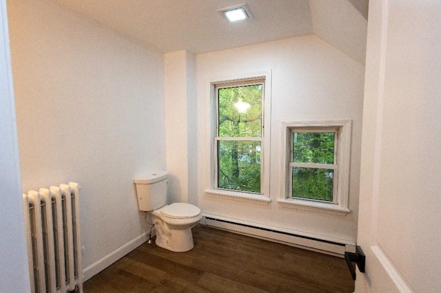 23 Highland St, Townsend, MA 01469 - bathroom featuring radiator heating unit, a baseboard heating unit, toilet, wood finished floors, and plenty of natural light