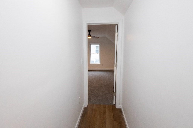 23 Highland St, Townsend, MA 01469 - hallway with lofted ceiling, baseboards, a baseboard heating unit, and dark wood-style floors