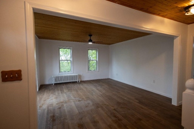 23 Highland St, Townsend, MA 01469 - unfurnished room featuring radiator, dark wood-style flooring, baseboards, a ceiling fan, and wooden ceiling