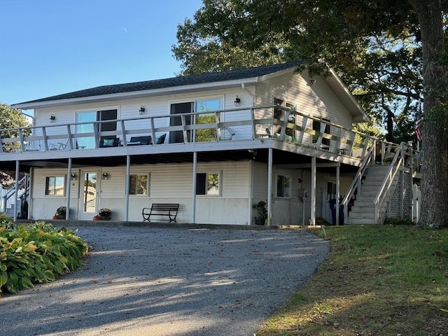64 Edgewater Dr, Wareham, MA 02571 - exterior space featuring a wooden deck, driveway, and stairs