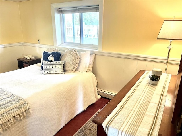 64 Edgewater Dr, Wareham, MA 02571 - bedroom featuring wainscoting, a baseboard heating unit, and dark colored carpet