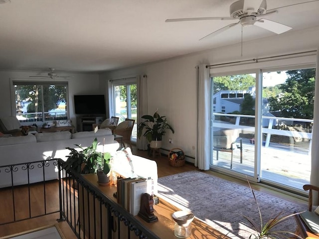 64 Edgewater Dr, Wareham, MA 02571 - living area with baseboard heating, a ceiling fan, and wood finished floors