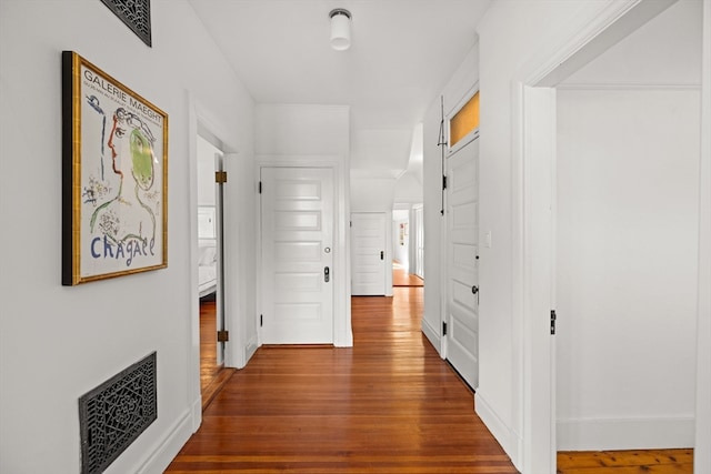 hallway featuring dark hardwood / wood-style floors