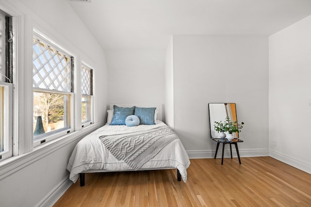 bedroom with light wood-type flooring