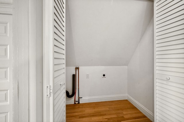 laundry area featuring hookup for an electric dryer and hardwood / wood-style floors