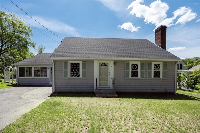 4 Cypress Rd, Natick, MA 01760 - view of front of property featuring a shingled roof, a chimney, and a front yard