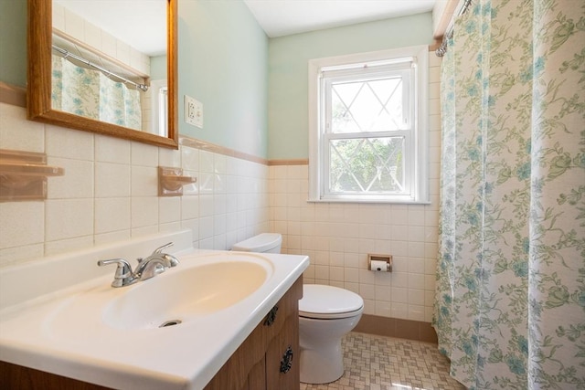 4 Cypress Rd, Natick, MA 01760 - bathroom featuring toilet, vanity, tile walls, a shower with curtain, and wainscoting