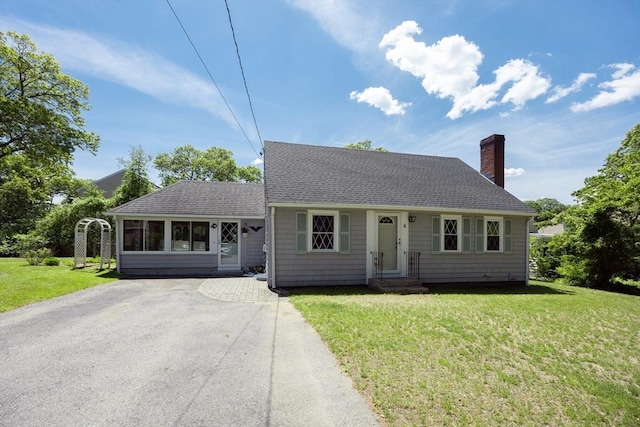 4 Cypress Rd, Natick, MA 01760 - view of front of home featuring a chimney, a shingled roof, a front lawn, and driveway