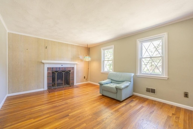 4 Cypress Rd, Natick, MA 01760 - sitting room featuring wood finished floors, a fireplace, baseboards, and ornamental molding
