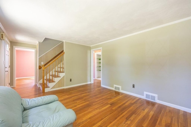 4 Cypress Rd, Natick, MA 01760 - living room with wood finished floors, stairway, baseboards, and crown molding