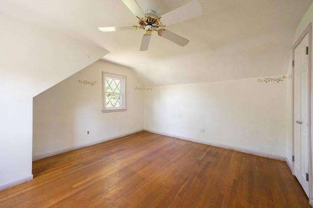 4 Cypress Rd, Natick, MA 01760 - additional living space featuring wood finished floors, vaulted ceiling, ceiling fan, and baseboards