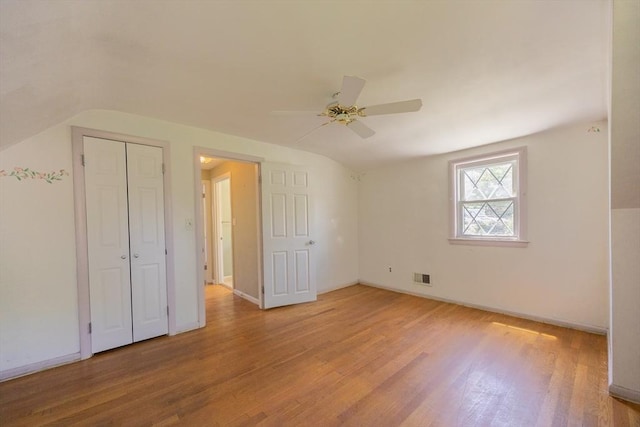 4 Cypress Rd, Natick, MA 01760 - unfurnished bedroom featuring vaulted ceiling, light wood-style flooring, baseboards, ceiling fan, and a closet