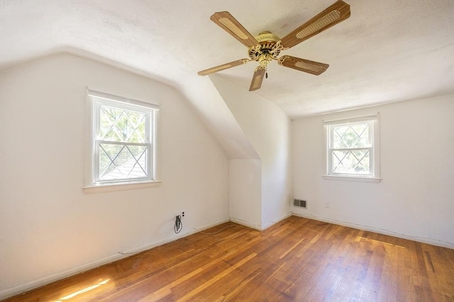 4 Cypress Rd, Natick, MA 01760 - additional living space with vaulted ceiling, healthy amount of natural light, wood finished floors, and ceiling fan