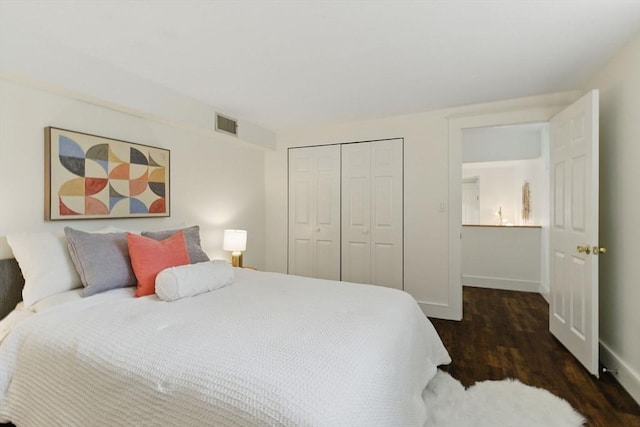 35 Nonantum St Unit E, Boston, MA 02135 - bedroom featuring wood finished floors, a closet, and baseboards