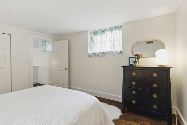 35 Nonantum St Unit E, Boston, MA 02135 - bedroom with dark wood finished floors and baseboards