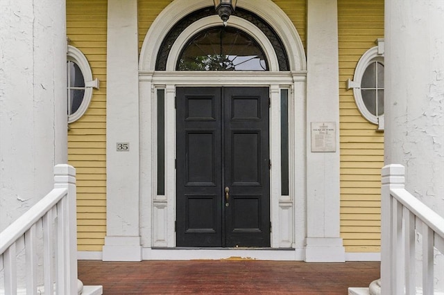 35 Nonantum St Unit E, Boston, MA 02135 - view of exterior entry featuring french doors and covered porch