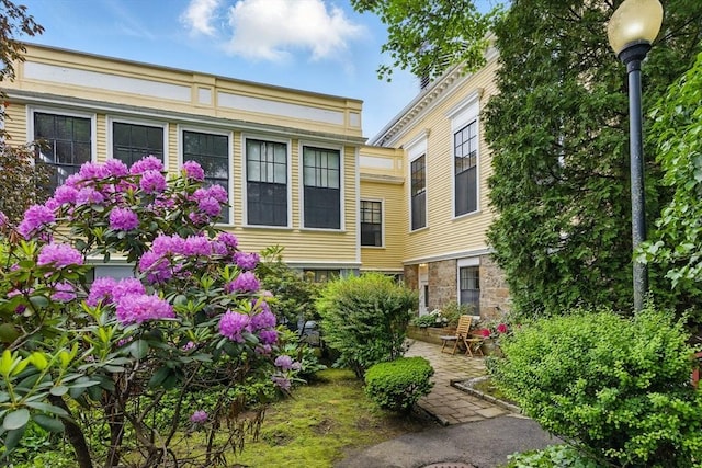 35 Nonantum St Unit E, Boston, MA 02135 - exterior space featuring stone siding