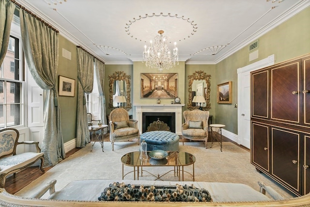 sitting room with crown molding, an inviting chandelier, and light hardwood / wood-style floors