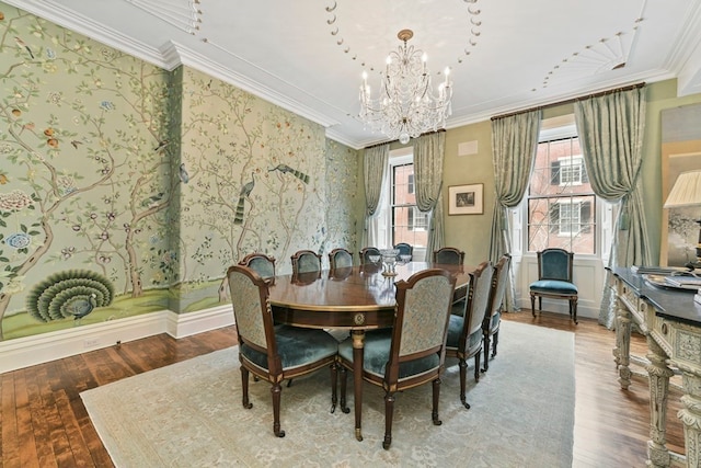 dining room featuring a notable chandelier, crown molding, and hardwood / wood-style flooring