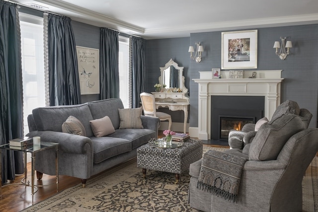 living room with dark hardwood / wood-style floors and crown molding