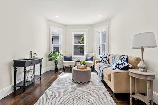 sitting room featuring dark wood-style floors, baseboards, and recessed lighting