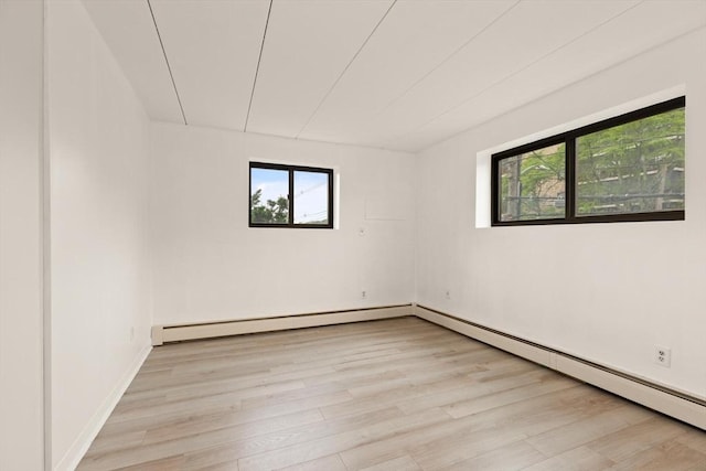 995 Massachusetts Ave Unit 301, Arlington, MA 02476 - spare room with light wood-style flooring and baseboard heating