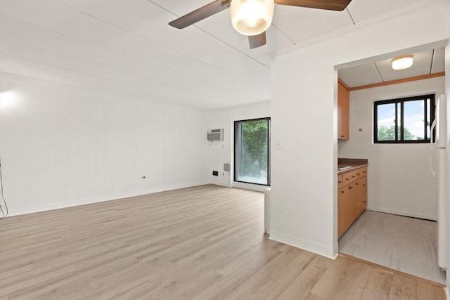 995 Massachusetts Ave Unit 301, Arlington, MA 02476 - unfurnished living room with ceiling fan, light wood-style floors, and ornamental molding