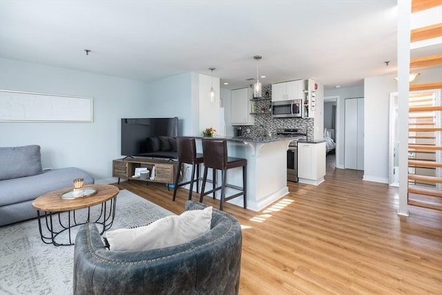 130 Tudor St Unit D, Boston, MA 02127 - living area featuring light wood-type flooring and baseboards