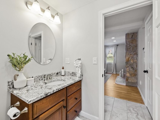 bathroom featuring vanity and baseboards