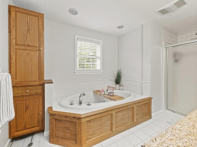 bathroom with a shower stall, a bath, visible vents, and tile patterned floors