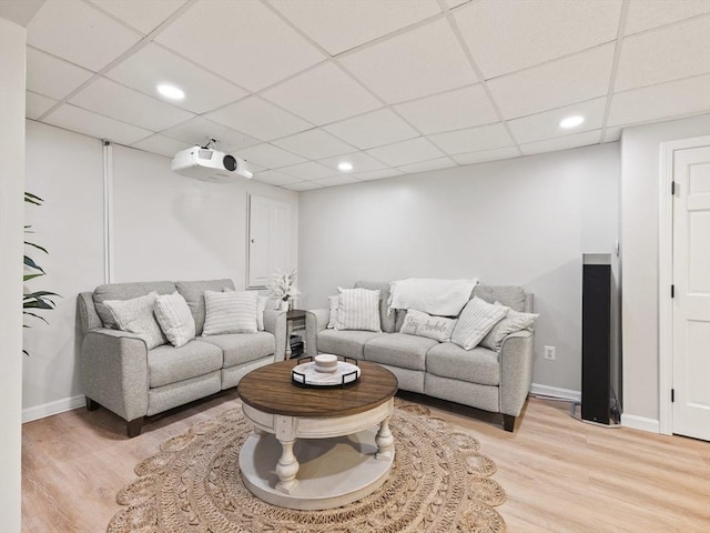 living room featuring recessed lighting, light wood-type flooring, and baseboards