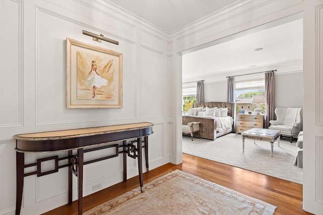 4 Cobb Ave, Manchester, MA 01944 - bedroom featuring a decorative wall, ornamental molding, and wood finished floors