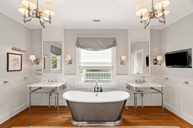 4 Cobb Ave, Manchester, MA 01944 - full bath featuring a chandelier, a decorative wall, wood finished floors, ornamental molding, and a freestanding tub
