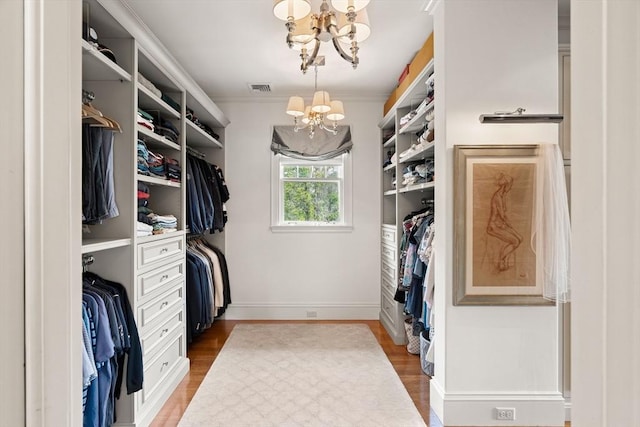 4 Cobb Ave, Manchester, MA 01944 - walk in closet featuring a chandelier and light wood-type flooring