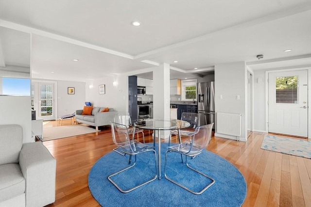 dining area with light wood-style floors, recessed lighting, and healthy amount of natural light