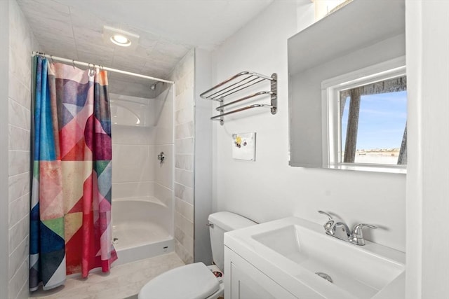 full bath with a shower stall, toilet, and vanity