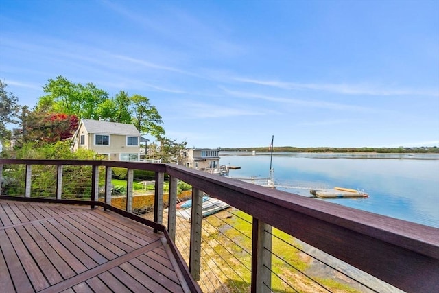 wooden deck featuring a water view