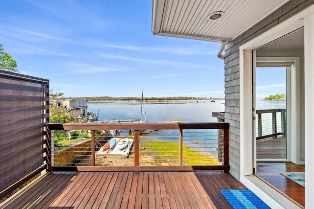 balcony featuring a water view