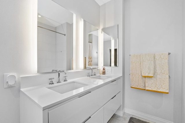 bathroom featuring vanity and a shower with shower curtain