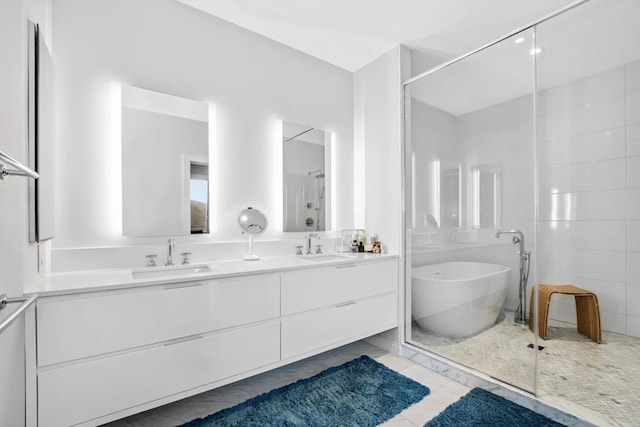 bathroom with vanity, separate shower and tub, and tile patterned floors