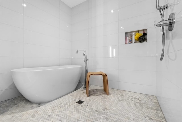 bathroom with independent shower and bath and tile walls