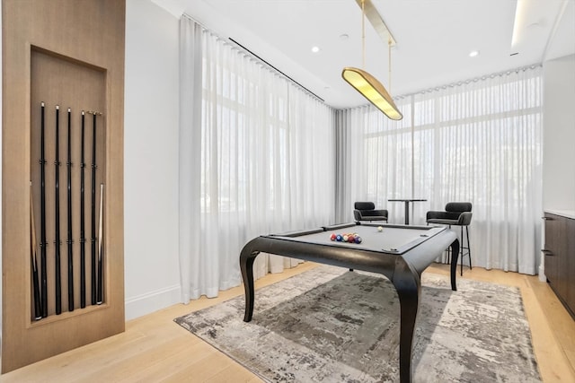 recreation room with light hardwood / wood-style flooring, floor to ceiling windows, and pool table