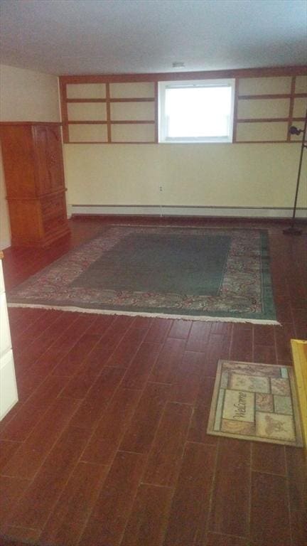 unfurnished room with dark hardwood / wood-style flooring